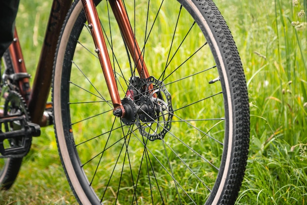 Close up bicycle wheel in the grass