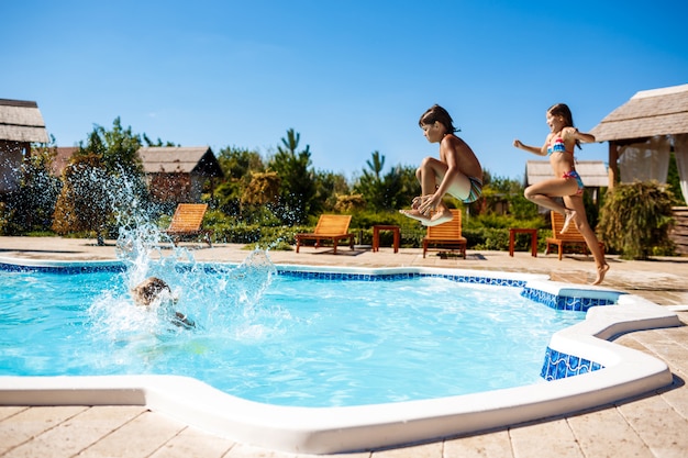 Children Rejoicing, Jumping, Swimming in Pool