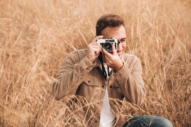 Front view man taking photos – Free Stock Photo for Download