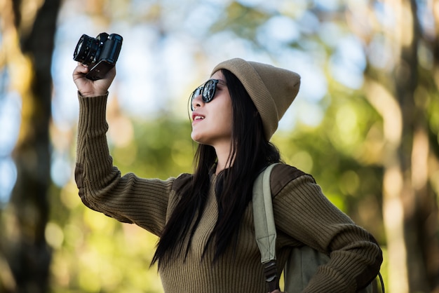 Woman traveler going alone in the forest