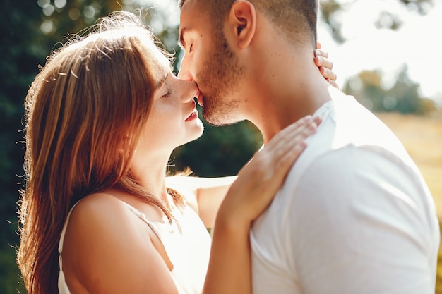 Beautiful couple spend time in a summer park