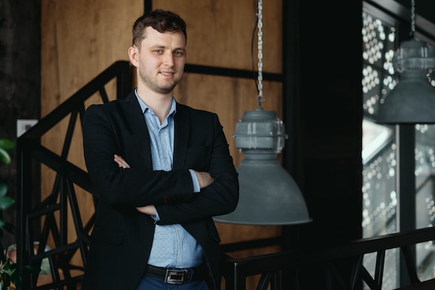 Man portrait posing in a loft modern space