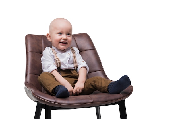 Adorable Baby Boy Sitting on Chair