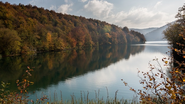 Beautiful Plitvice Lake in Croatia Surrounded by Colorful-Leafed Trees