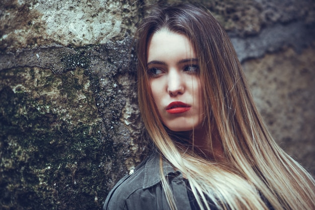 Serious teenager with long hair and red lips – Free Stock Photo Download