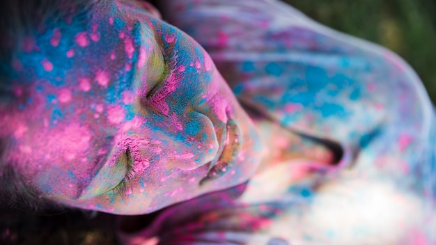 High Angle View of Pink and Blue Holi Color on Woman’s Face