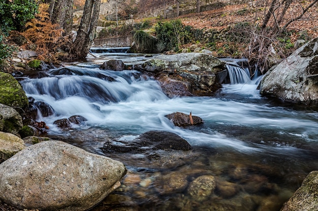 Vibrant River Scenery Flowing Over Rocks with Long Exposure