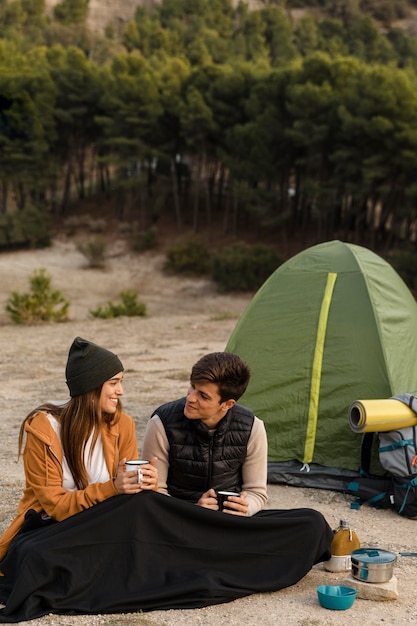 Couple Camping in the Forest Long Shot