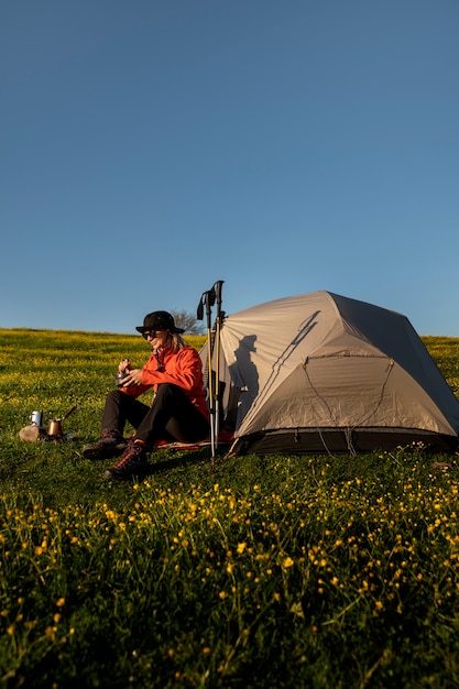 Woman Sitting by the Tent