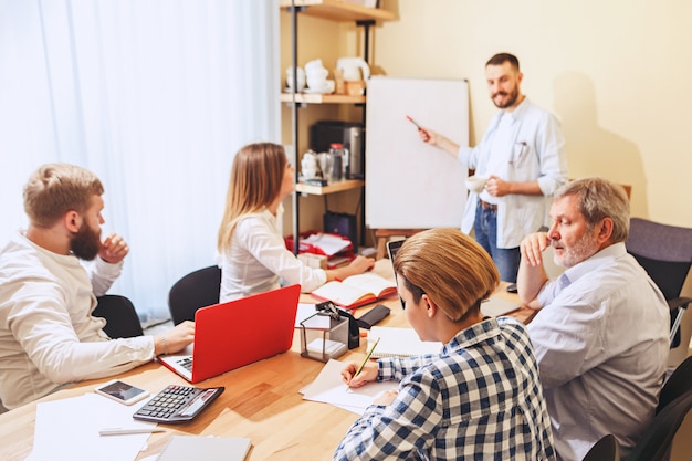 Team Job: Young Businessmen Working on New Project in Office