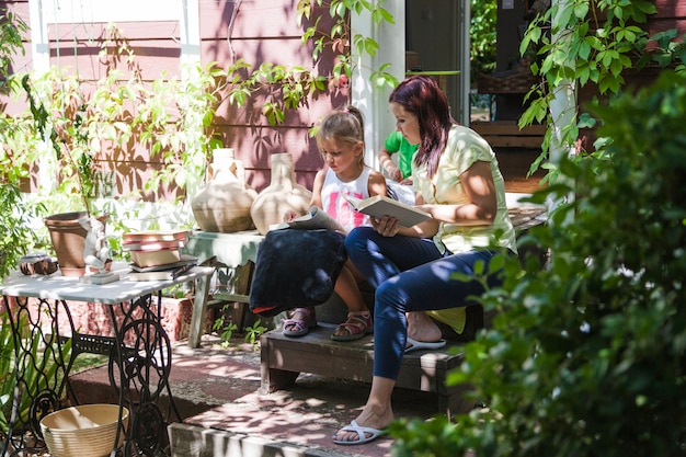 Woman with daughter on porch