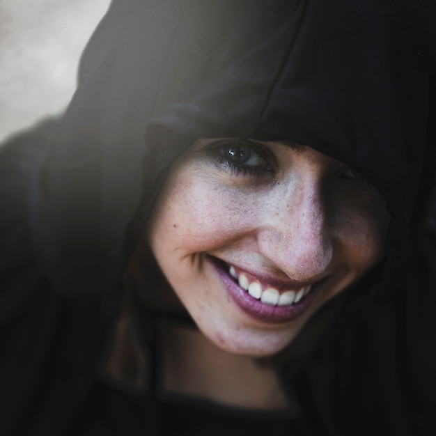 Smiling Witch in Black Hood