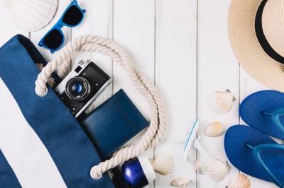 Camera and Passport Bag Beside Beachwear – Free Download