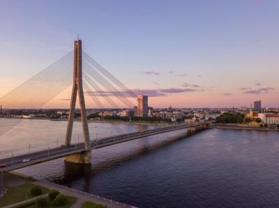 Vansu Bridge Over Daugava River at Sunset in Riga, Latvia – Free Download