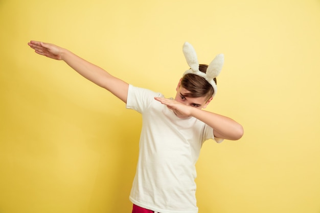 Boy as an Easter Bunny on Yellow Studio Wall – Free Download