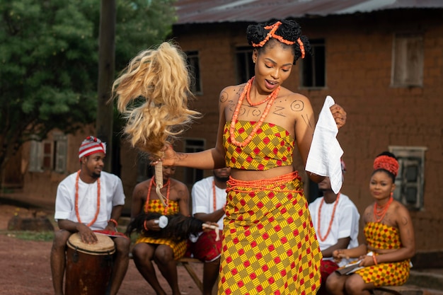 Medium Shot of Nigerian Dancers Outdoors – Free to Download