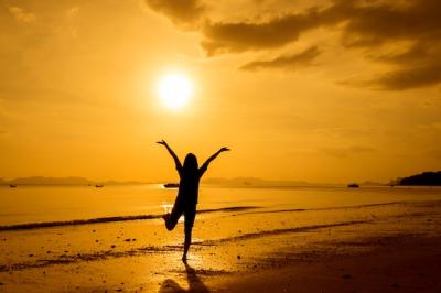 Relaxed Woman Overlooking the Sea on the Beach – Free Download