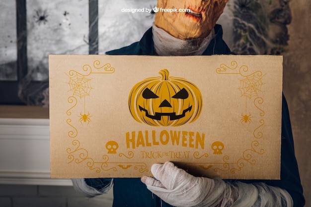 Halloween Mockup Featuring a Man Holding Cardboard – Free Download