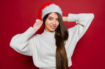 Happy Woman with Amazing Long Hair in Santa Hat – Free Stock Photo for Download