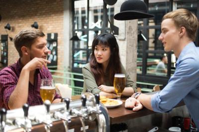 Customers Chatting With Bartender in Pub – Free Stock Photo for Download