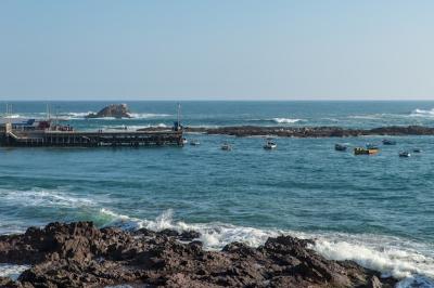 High Angle Shot of Boats on the Sea Near the Dock and Rocky Shore – Free Download