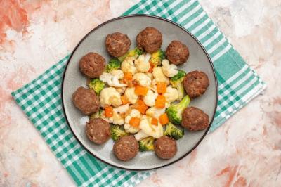 Broccoli and Cauliflower Salad with Meatballs on Green and White Checkered Napkin – Free Download