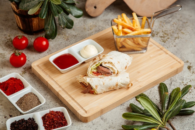 Delicious Meat Wrap in Flatbread with French Fries and Sauces – Free Stock Photo for Download