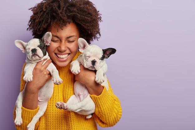 African American Woman in Yellow Sweater with Puppies – Free Stock Photo, Download for Free