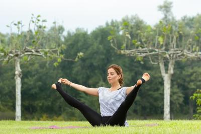 Young Beautiful Woman Practicing Yoga in a Green Park – Free Stock Photo for Download