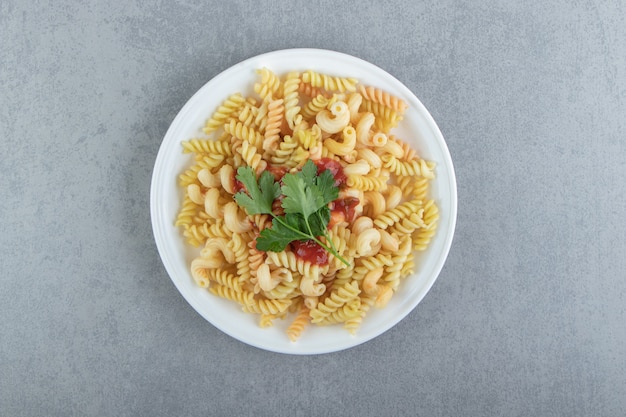 Fusilli Pasta with Sauce on a White Plate – Free Download