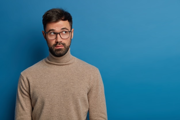 Thoughtful Bearded Guy with an Unaware Expression – Free Stock Photo, Download Free