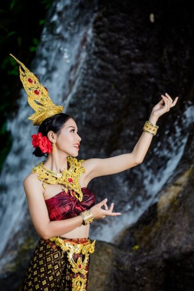 A Woman in Ancient Thai Dress at a Waterfall – Free to Download