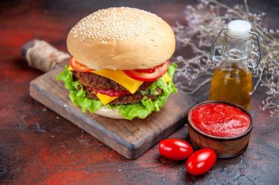 Tasty Meat Burger with Cheese on Dark Background – Free Stock Photo Download