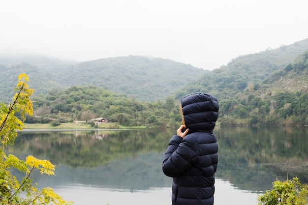 Serene Woman Enjoying a Scenic Lake Landscape – Free Stock Photo for Download