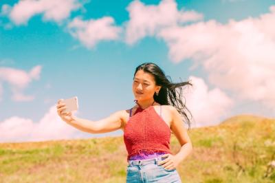 Asian Woman Taking Photos in a Field – Free Stock Photo, Download for Free