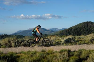 Young Adult Riding an Electric Bike in the Countryside – Free Download