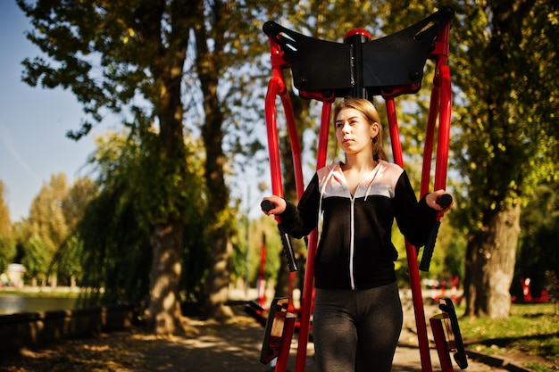 Young Girl Exercising Outdoors on Street Simulators – Free Stock Photo, Download for Free