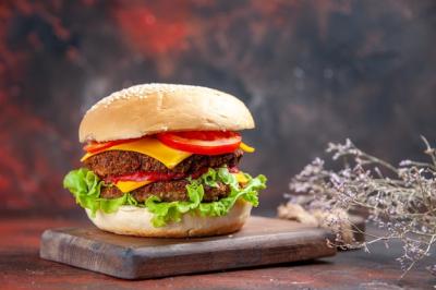 Delicious Meat Burger with Cheese and Salad on Dark Background – Free Download