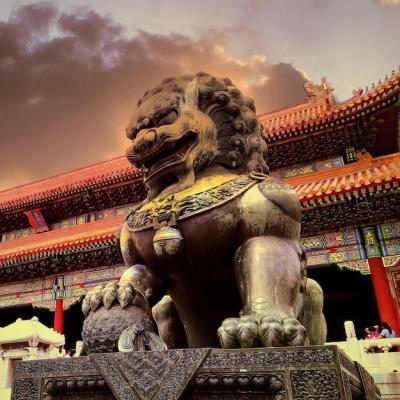 Statue and Temple Against Cloudy Sunset Sky – Free Download