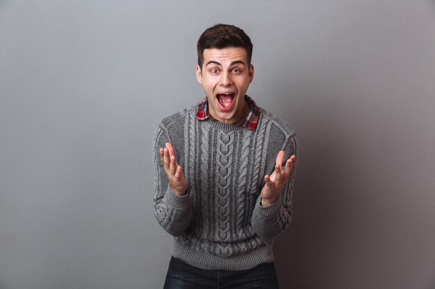 Shocked Happy Brunette Man in Sweater Screaming and Looking – Free Stock Photo, Download for Free