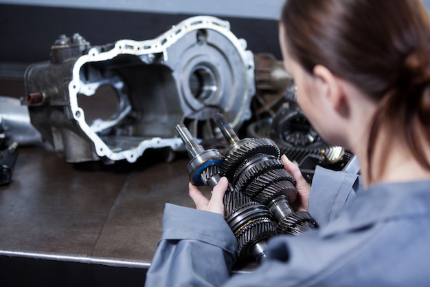 Female Mechanic Holding Spare Parts – Free Stock Photo, Download for Free