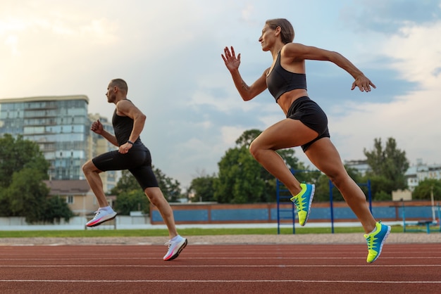 Man and Woman Running on Track – Free Stock Photo for Download