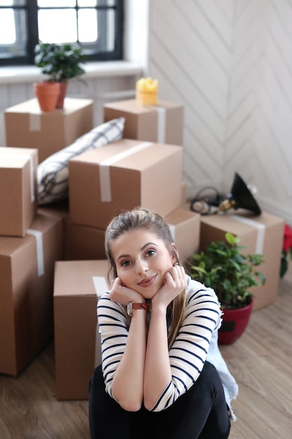 Woman Relaxing Next to Cargo Boxes – Free Stock Photo, Download for Free