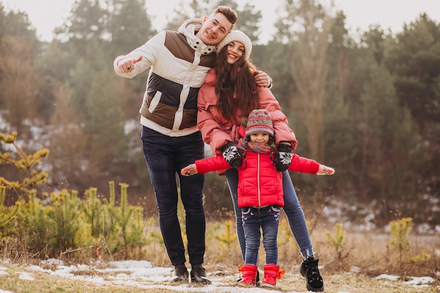 Young Family Walking in a Winter Forest – Free Stock Photo for Download