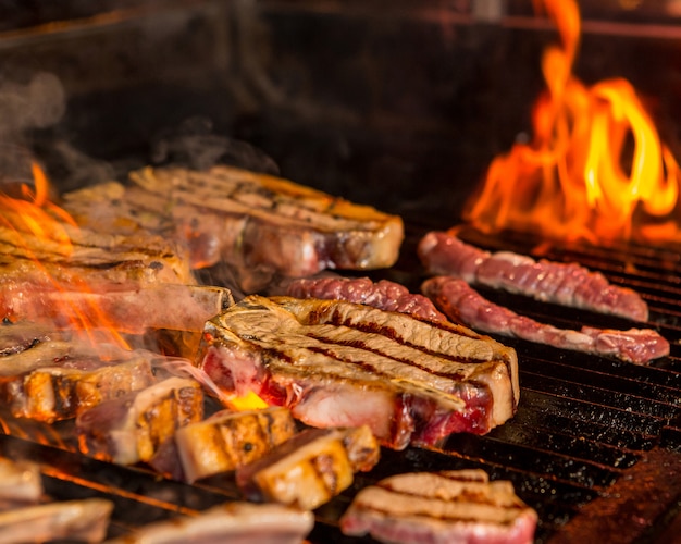 Grilled and Raw Steaks on the Grill – Free Stock Photo, Download for Free