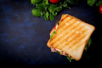 Big Club Sandwich with Ham, Bacon, Tomato, Cucumber, Cheese, Eggs, and Herbs – Free Download