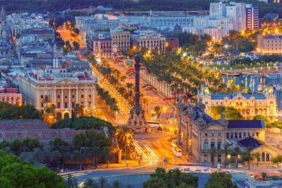 Aerial View of Portal de la Pau and Port Vell Marina with Columbus Monument at Night in Barcelona, Catalonia, Spain – Free Download