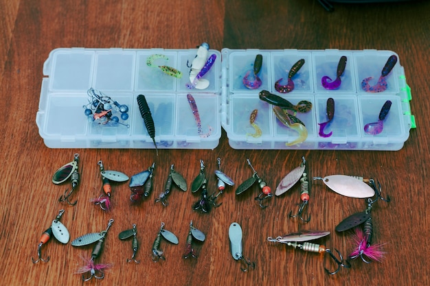 Fishing Lures and Boxes on Wooden Desk – Free Download