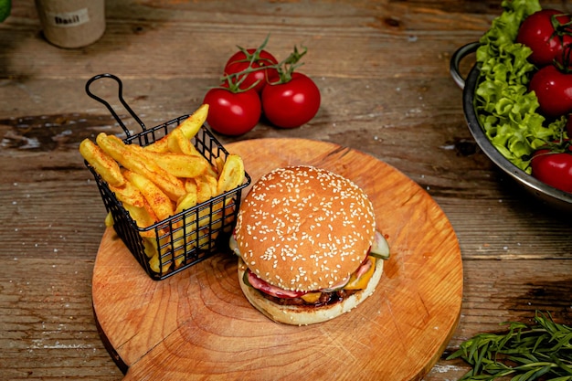 Big Burger and French Fries Served on a Wooden Board – Free Stock Photo, Download for Free