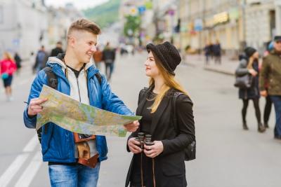 Smiling Man and Woman Holding a Map – Free Stock Photo, Download for Free